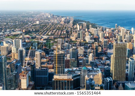Business concept for real estate and corporate construction - panoramic urban city skyline aerial view under blue sky in Chicago, America