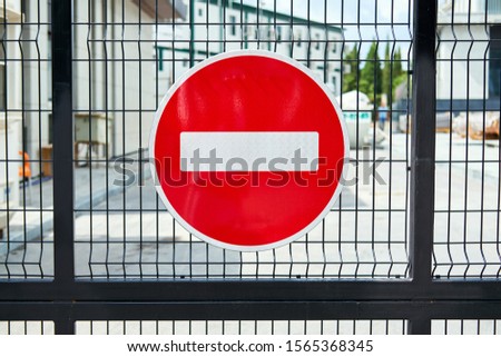 Close-up view of the stop sign on the private territory gate. Warning, the entry is closed.