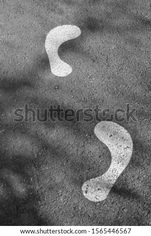 footprint shape in the asphalt