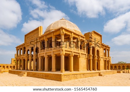 Makli Hill Necropolis UNESCO World Heritage Site Picturesque View of a Mausoleum of Isa Khan Tarkhan II on a Sunny Blue Sky Day Royalty-Free Stock Photo #1565454760