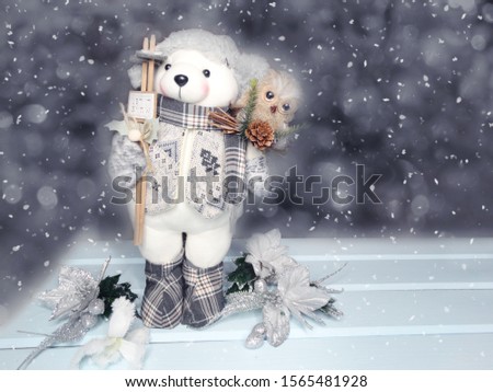 winter christmas background with snowman decor snow on blue wooden texture                              