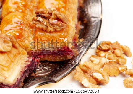 Stacked turkish baklava dessert in a plate close up