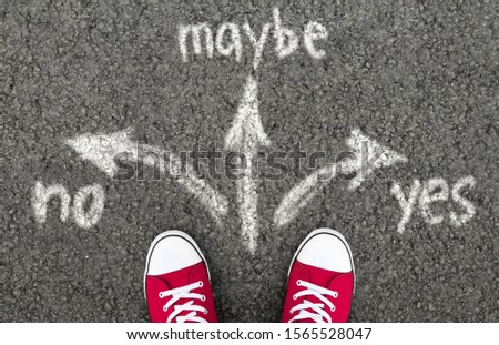 Yes, No, Maybe. Teenager standing on asphalt road unable to make a decision. Top view.
