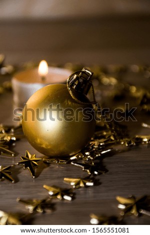 christmas still life with candle and decorations