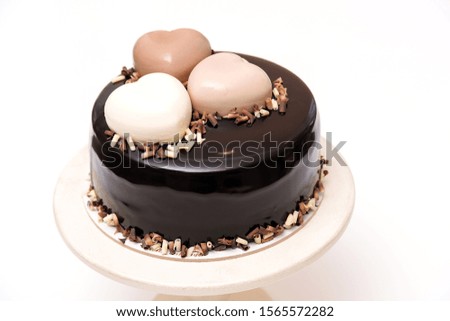 Birthday chocolate cake on a table. Tasty cake with hearts for celebration. Happy Valentine day