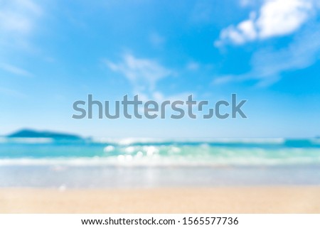 Copy space blur tropical beach with bokeh sun light wave on blue sky and white cloud abstract background. Summer vacation outdoor and travel holiday adventure concept. Vintage tone filter effect color