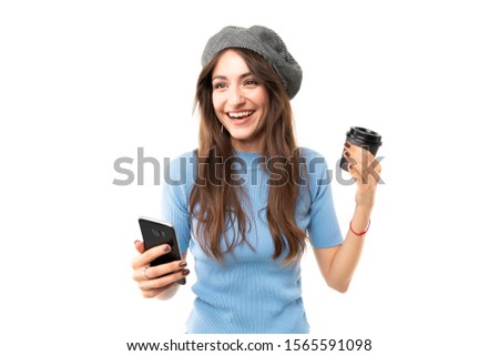 Caucasian female with cap drinks coffee and smiles, picture isolated on white background