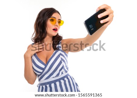 Beautiful young woman with perfect smile, sunglasses do selfie, isolated on white background