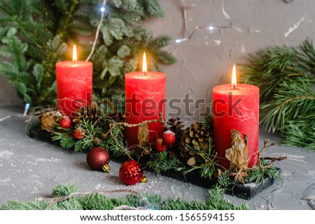 Christmas decoration composition with red candles