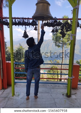 Ring bells in temple Golden metal bell isolated  Pauri Garhwal India