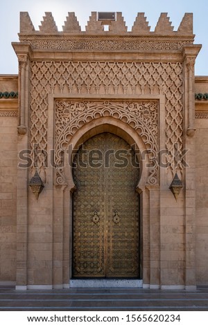 Golden door in Rabat Morocco. Photo taken at the Hassan Tower and Mosque in Rabat.  Royalty-Free Stock Photo #1565620234