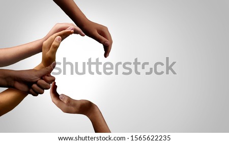 Diversity and unity partnership as a business startup and teamwork or togetherness concept with hands joined together in a group of diverse connected people. Royalty-Free Stock Photo #1565622235