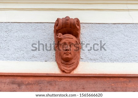 Face of stone on a wall