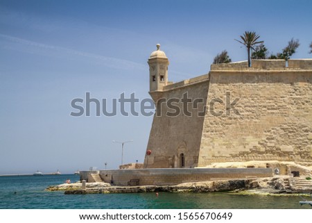 
Malta from sea view. The traditional houses and walls of Valletta, the capital city of Malta on an early summer morning before sunrise with clear blue sky. Three Cities bay.
