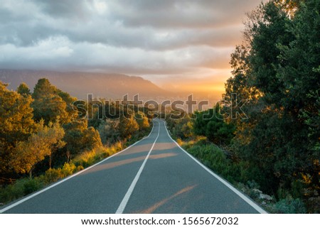 Beautiful sunset over a mountain road in the island of Mallorca.