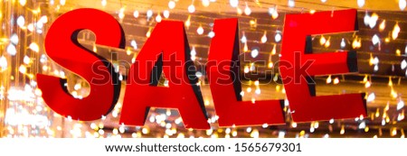 Golden Sale: Store Discount Sign on Shimmering Red Background