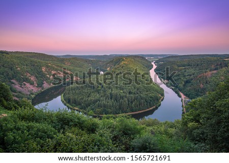 The "Saarschleife" of Saarland, Germany at the sunset. The place where the river Saar makes a turn. Royalty-Free Stock Photo #1565721691