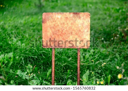 blank sign for your text on the grass background