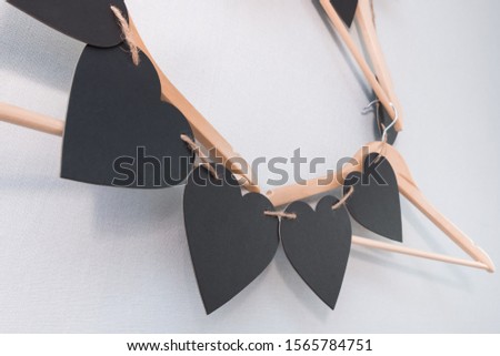 heart shaped tag garland on empty hangers