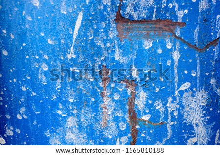 Metal texture with scratches and cracks which can be used as a background. Grunge texture of old rusty metal. Blue metal are rusty and peeling paint
