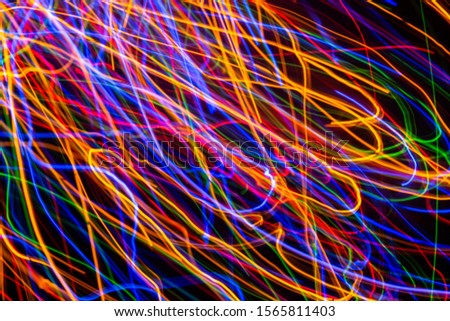 Colorful lights on the long exposure with motion background, Abstract glowing colorful lines, slow speed shutter
