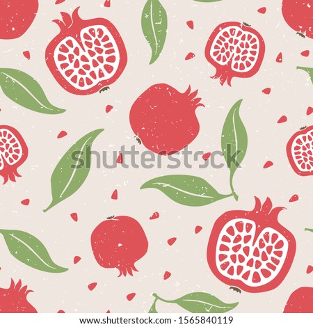 Pomegranate seamless pattern. Ripe pomegranate grains and leaves on gray shabby background.  Can be used for wallpaper, fabric, wrapping paper or decoration. Vector hand drawn illustration Royalty-Free Stock Photo #1565840119