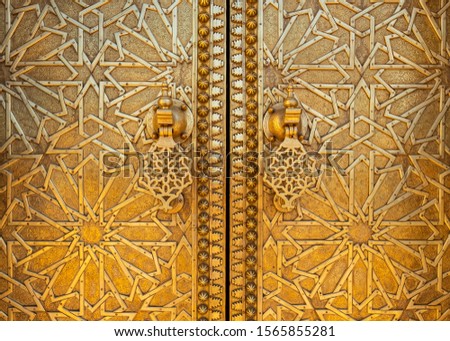 Golden door and Mosaic of the main gates to the Royal Palace of Fes, Morocco. Royalty-Free Stock Photo #1565855281