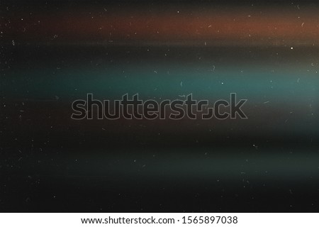 Old grunge background. Retro film photography effect.  Lens flare and heavy grain. 70s Royalty-Free Stock Photo #1565897038