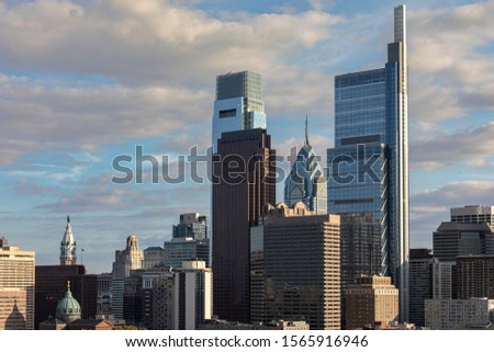 Philadelphia, Pennsylvania Cityscape with Skyscrapers and Cloudy Blue Sky