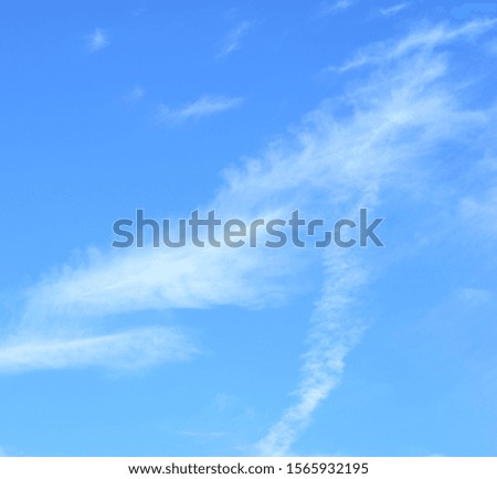 White clouds in front of blue skies