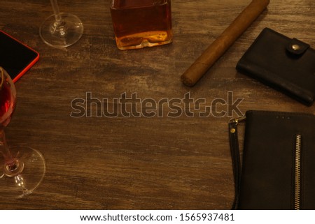 business meeting over a glass of alcohol with a glass bottle