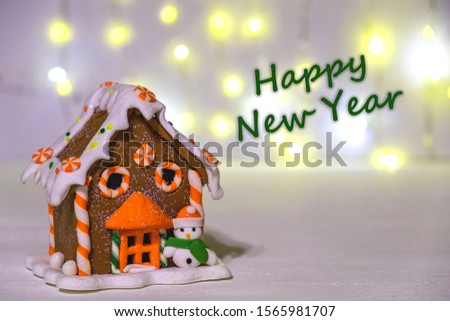Gingerbread house on a background of blurry lights