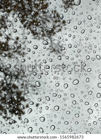 Close up of the rain drops on the glass
