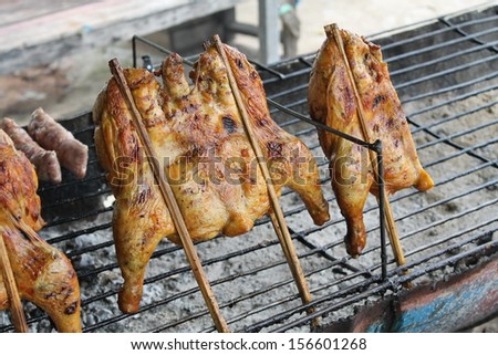 Grilled chicken on the grill.