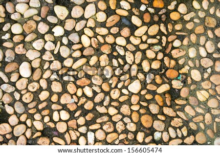 Pebble cement wall texture background 