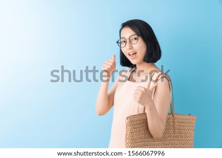 young attractive asian woman having a bag