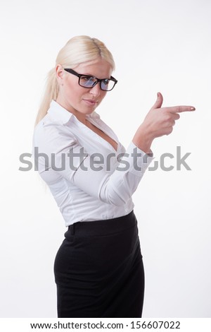 Businesswoman is showing something with her finger  