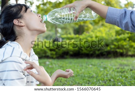 Asian child girl patient with weakness,  woman suffer from muscular weak or cervical spine osteoarthritis,nerve compression,sensory loss,causes her hands,arms or limbs to be in trouble and in pain Royalty-Free Stock Photo #1566070645