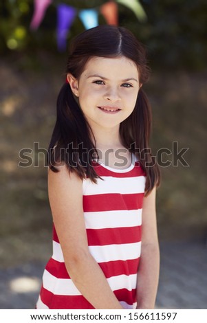 Young girl in striped dress, portrait