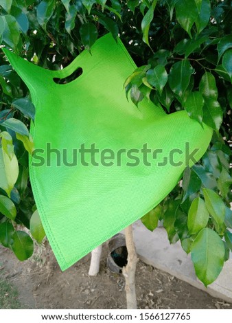 Non Woven ECO Friendly Bag on green 