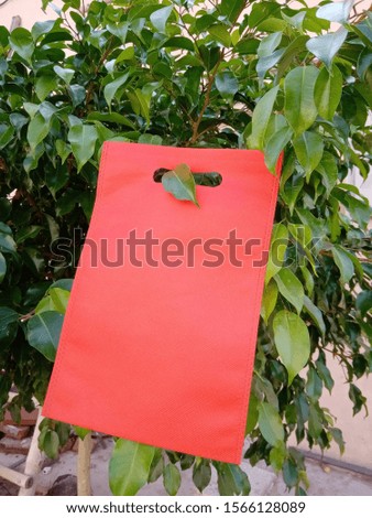 Non Woven ECO Friendly red Bag on green