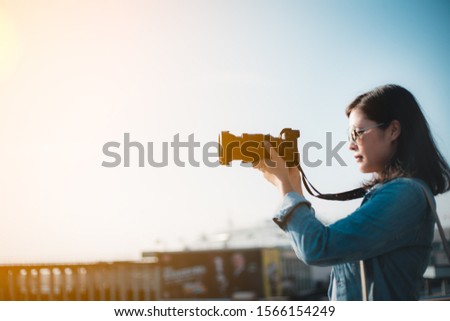 Female photographer taking photo in Hong Kong 