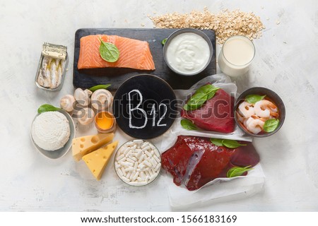 Natural sources of Vitamin B12 (Cobalamin) for normalization of sleep;  ensuring normal brain function; supporting the respiratory system;  alzheimer's deasease treatment. Top view  Royalty-Free Stock Photo #1566183169