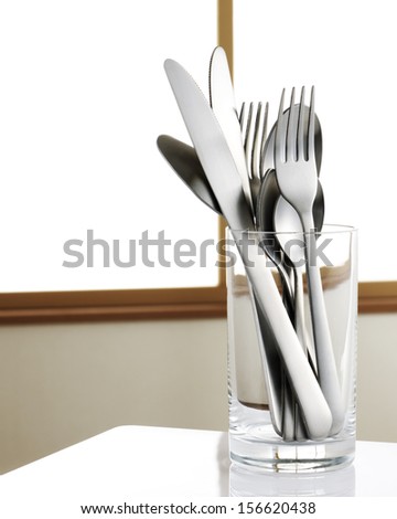 spoon knife and fork in glass