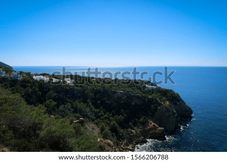 Ibiza Island coast near Es Vedra with blue water, Spain