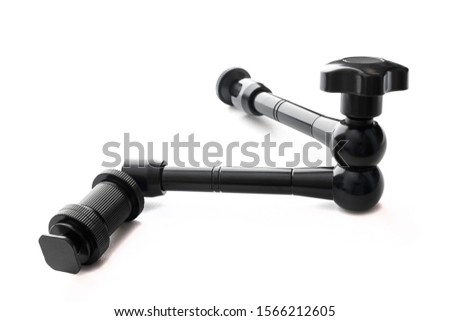Black photo accessories. Magic Arm Articulating Friction Arm with Hot Shoe Mounts for DSLR Camera. Isolated on a white background. Copy space.