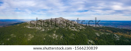 Aerial panoramic drone view of rocky Mount Monadnock summit Royalty-Free Stock Photo #1566230839