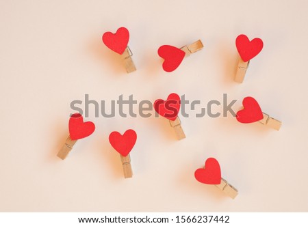 Hearts red clothespins on a white background