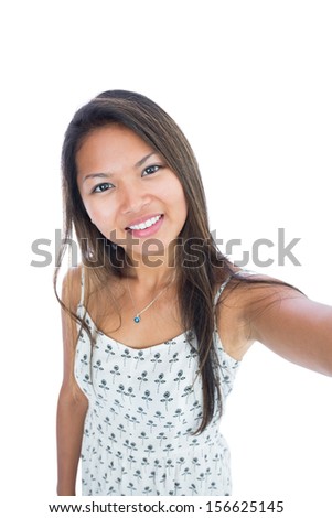 Beautiful young woman smiling at camera on white background