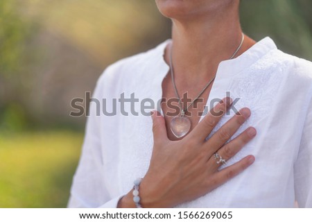 Spiritual Healer Expressing Honesty with her Hands  Royalty-Free Stock Photo #1566269065